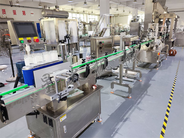 全自动搓滚式圆瓶贴标机实拍图